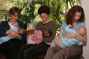 Three mums breast feeding