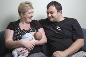 Couple with breast feeding baby