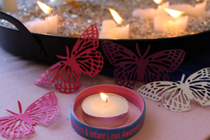 Candles and paper butterflies