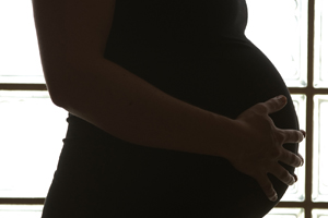 Silhouette of pregnant belly