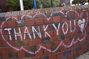 Thank you chalked on a brick wall