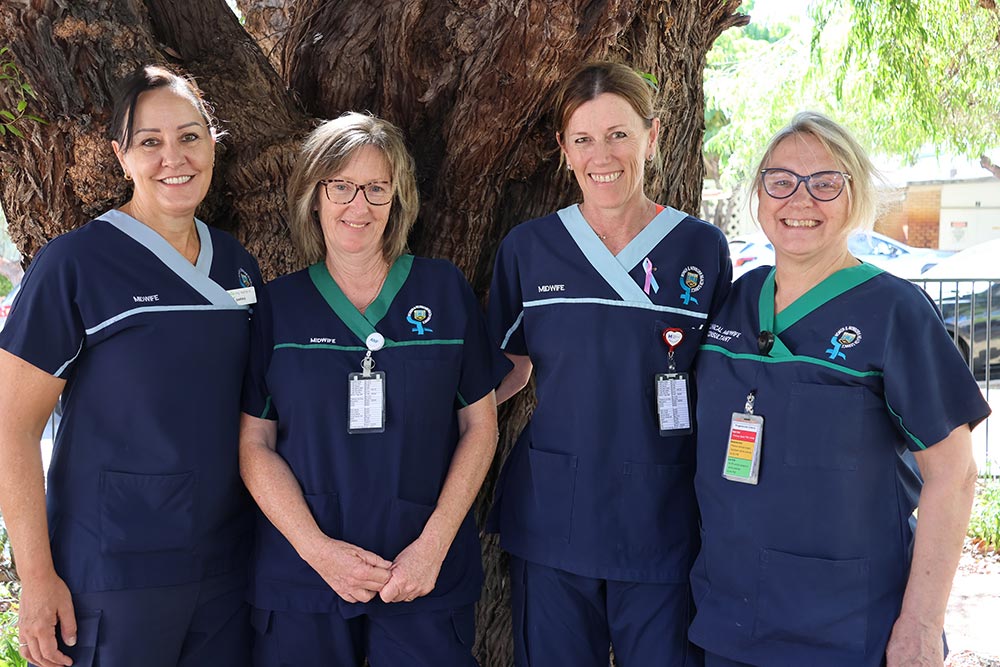 A group of four nurses/midwives